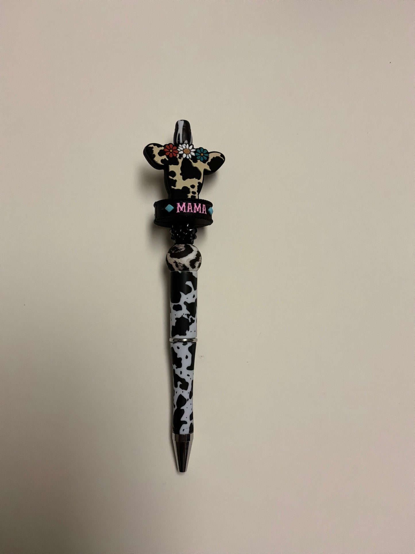 beaded brown cow head with black and white cow print pen
