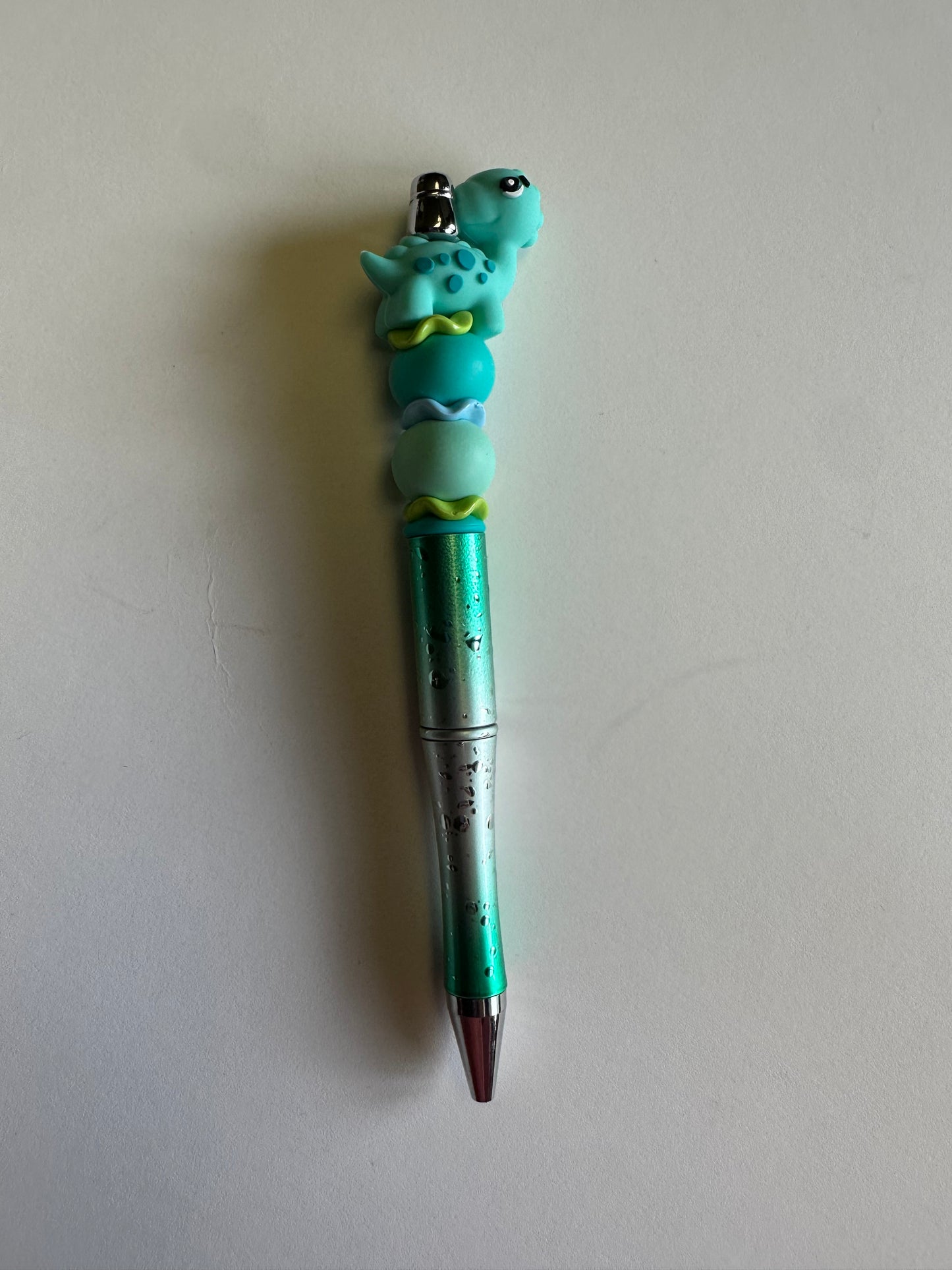 Beaded Blue Dino metallic blue and silver metallic flake pen