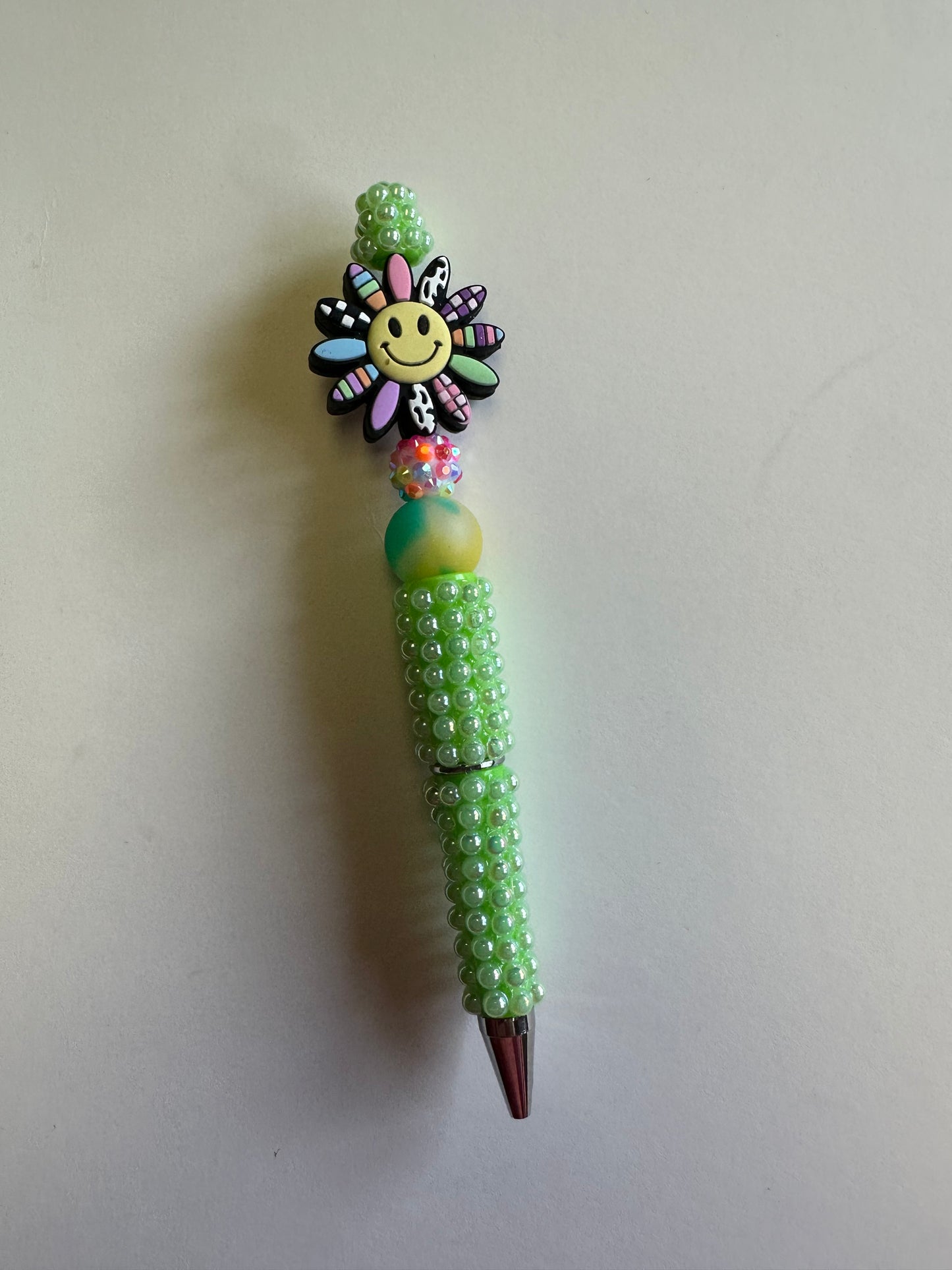 Beaded colorful sun with bubble green pen