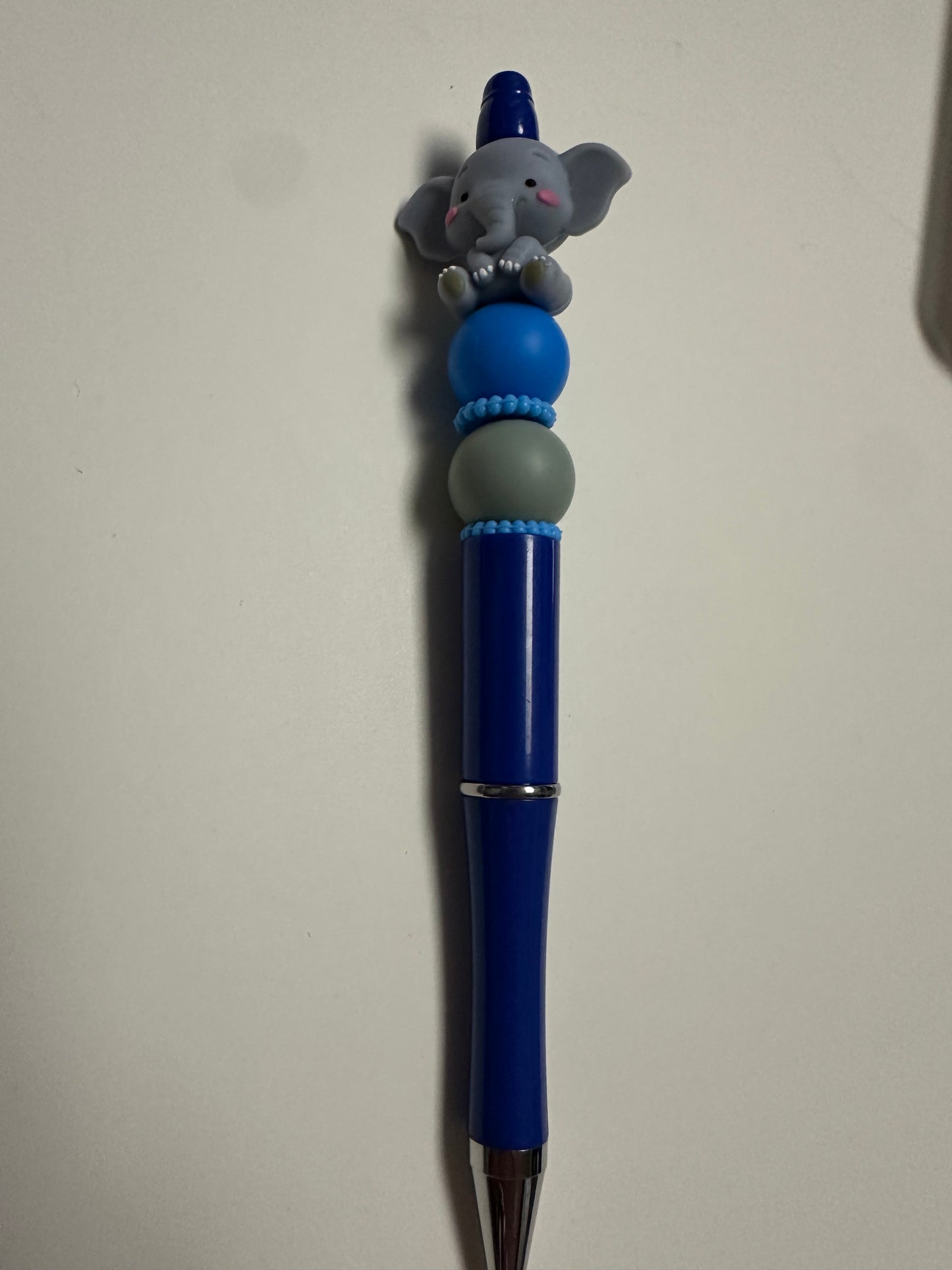 Blue beaded pen with elephant focal