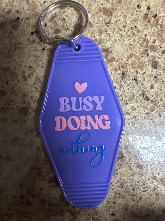 Busy Doing Nothing Light Purple Keychain