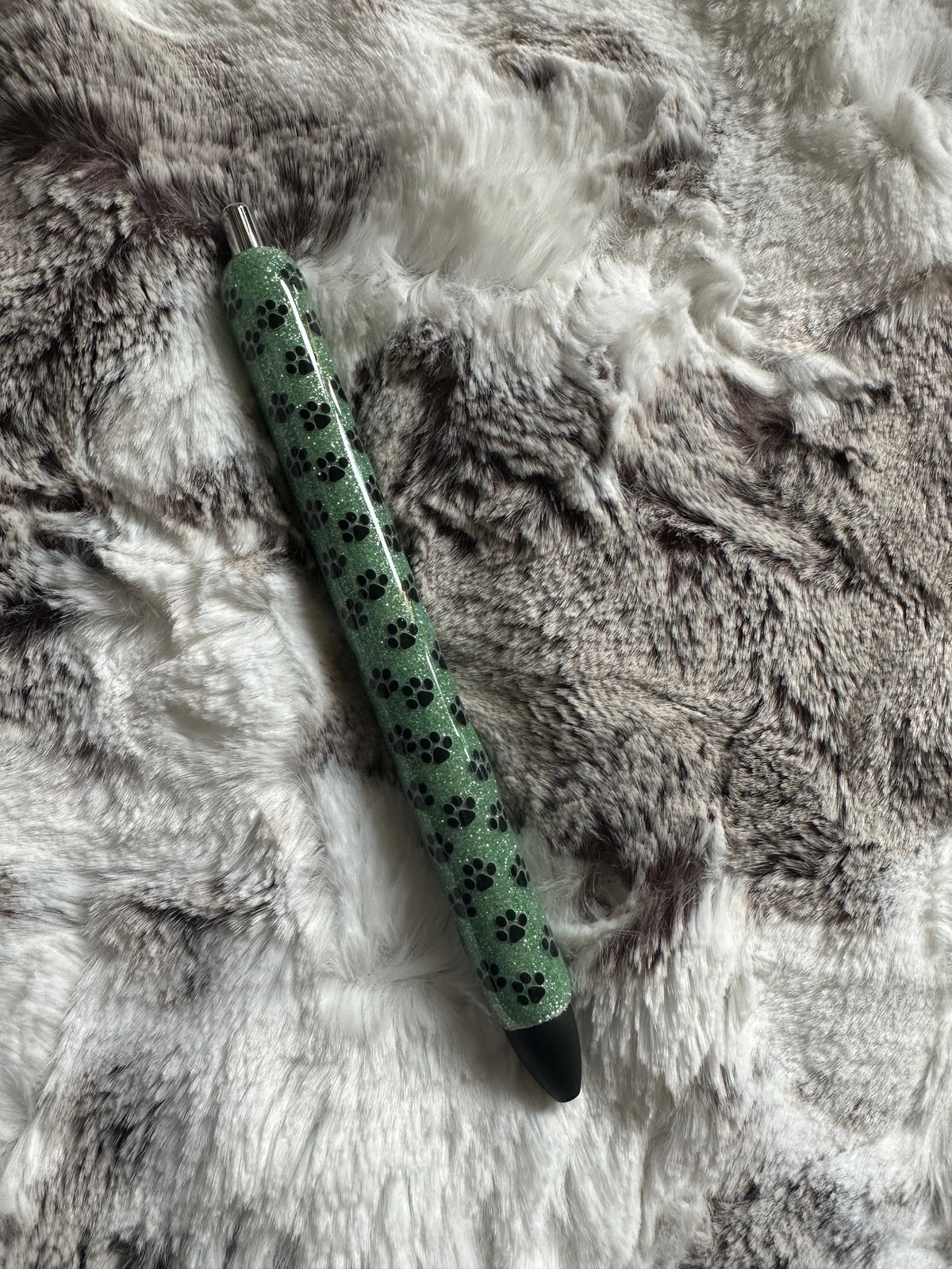 Light green epoxy pen with paw prints.