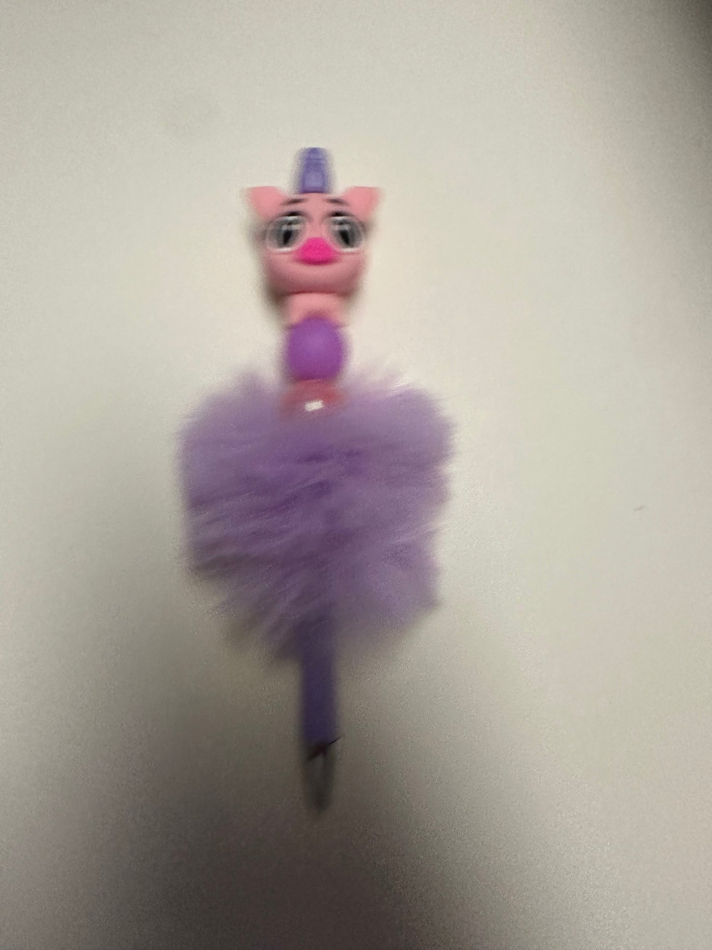 Purple fluffy pen with pink pig focal