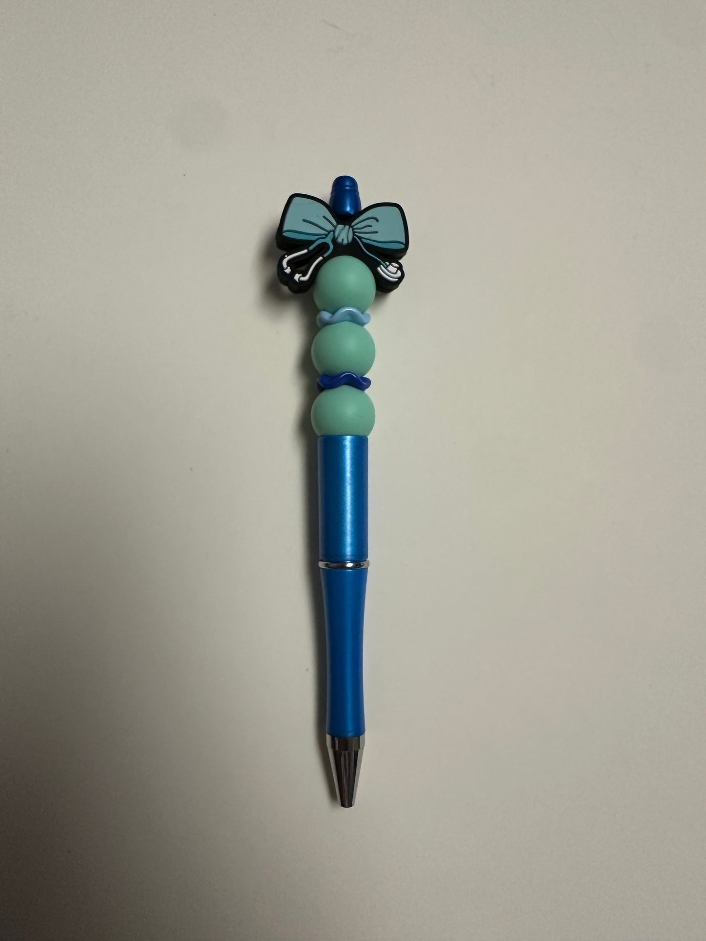 Blue metallic pen with nurse bow focal