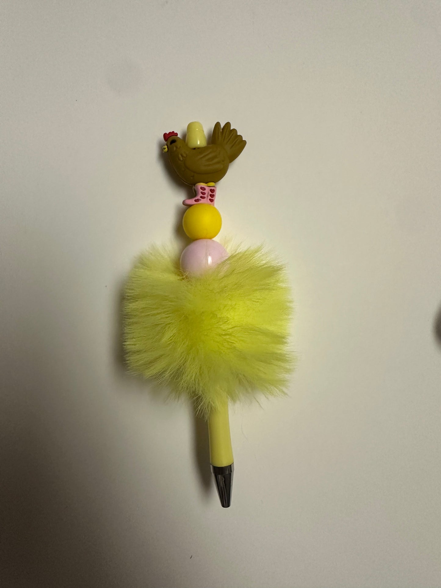 Yellow fluffy pen with chicken focal