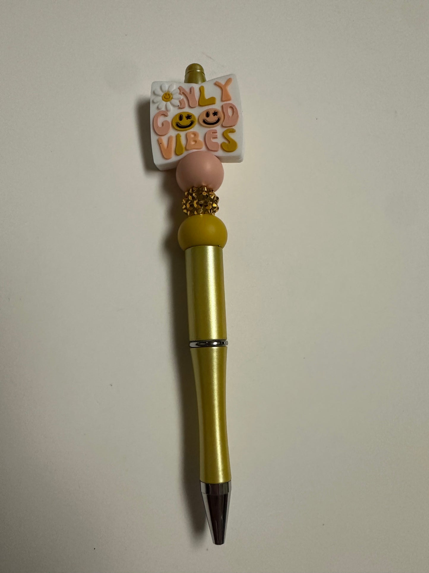 Gold beaded pen with good vibes focal